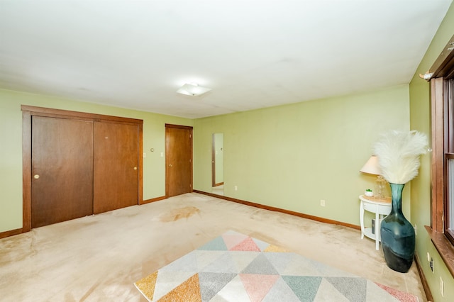 unfurnished bedroom with light carpet