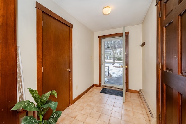 doorway to outside featuring a baseboard radiator