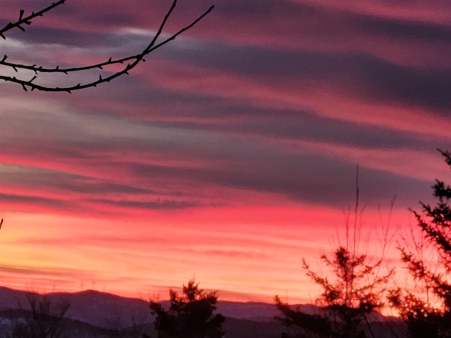 nature at dusk featuring a mountain view