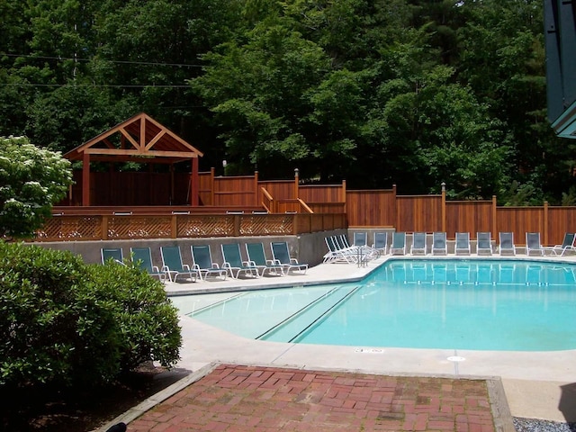 view of swimming pool featuring a gazebo