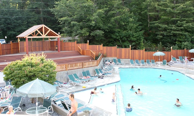 view of swimming pool featuring a gazebo and a patio