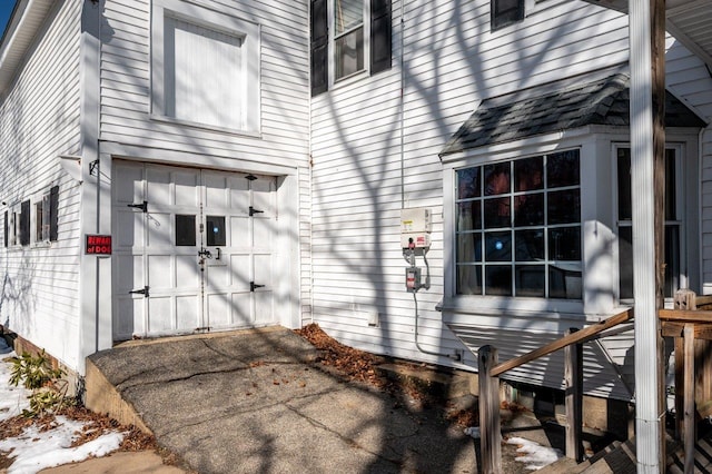 view of side of property with a garage