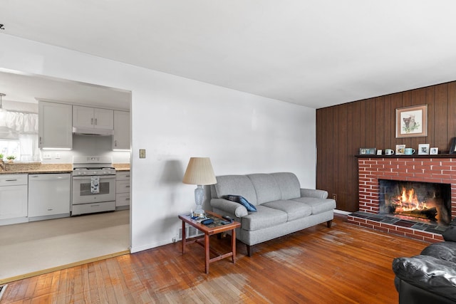 living room featuring hardwood / wood-style flooring and a fireplace