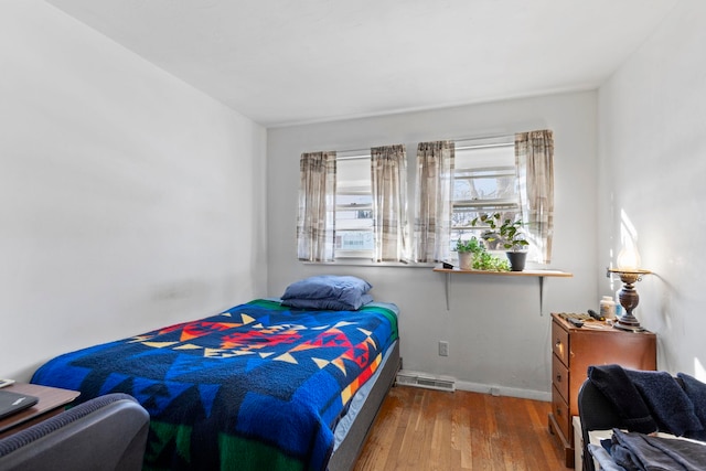 bedroom with hardwood / wood-style flooring