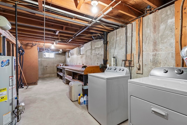 basement featuring washer and dryer and gas water heater