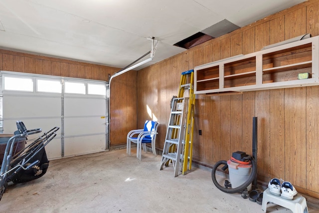 garage featuring wood walls