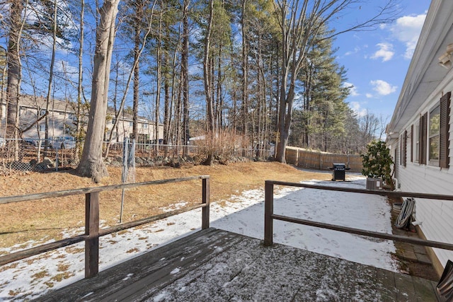 snow covered deck with area for grilling