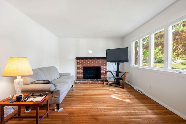 50 Suzanne Dr, Portsmouth, NH 03801 - living room featuring plenty of natural light, light wood-style floors, and baseboards