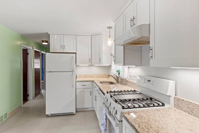 kitchen with pendant lighting, white cabinetry, sink, light stone counters, and white appliances