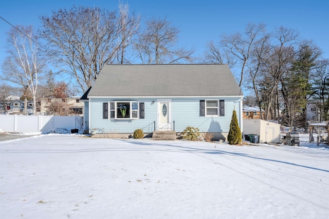 view of front of house with a shed