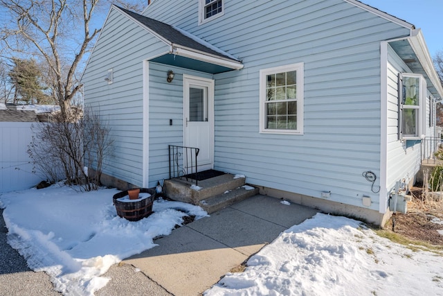 view of snow covered property entrance