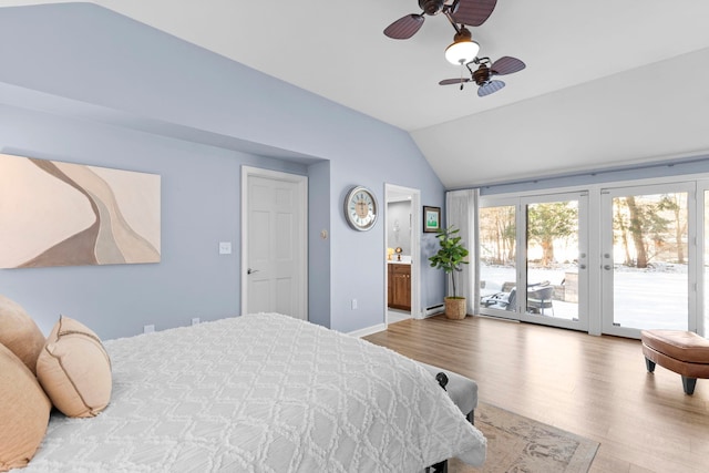 bedroom with ceiling fan, lofted ceiling, ensuite bath, and access to outside