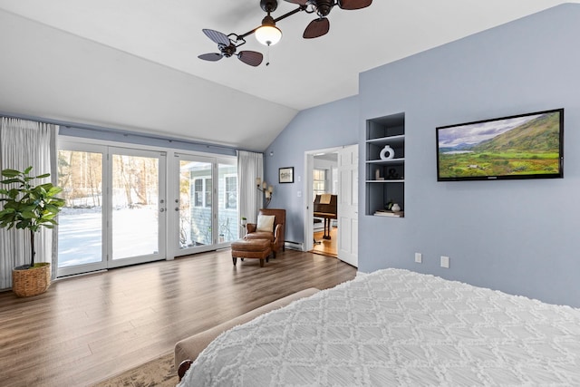 bedroom with lofted ceiling, access to outside, a baseboard radiator, ceiling fan, and hardwood / wood-style floors