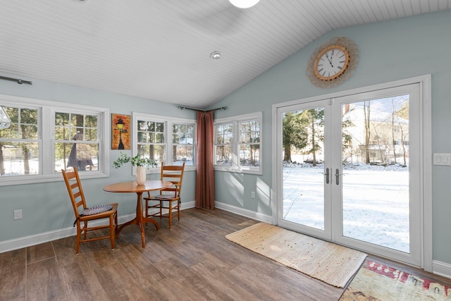 sunroom with lofted ceiling, a healthy amount of sunlight, and french doors