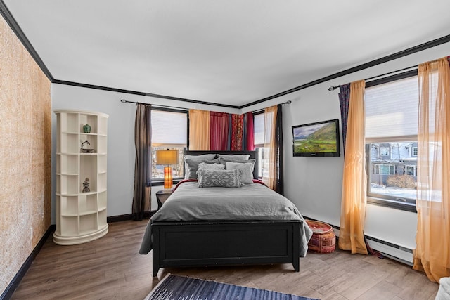 bedroom with multiple windows, wood-type flooring, and ornamental molding