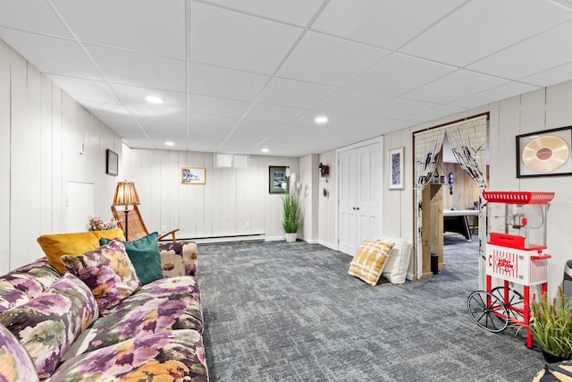 carpeted living room featuring a baseboard heating unit