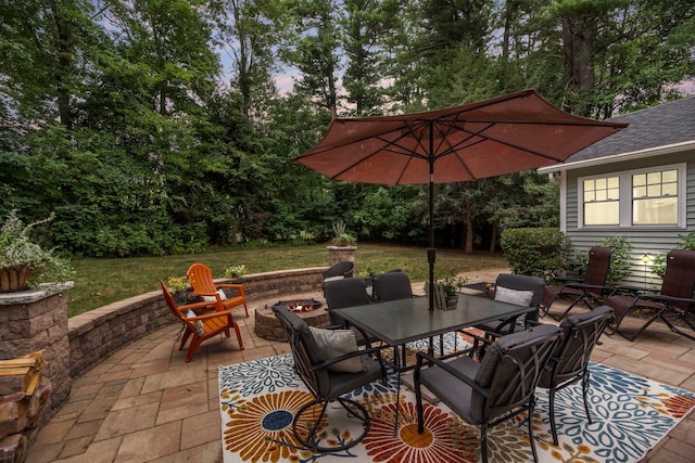 view of patio / terrace with an outdoor fire pit