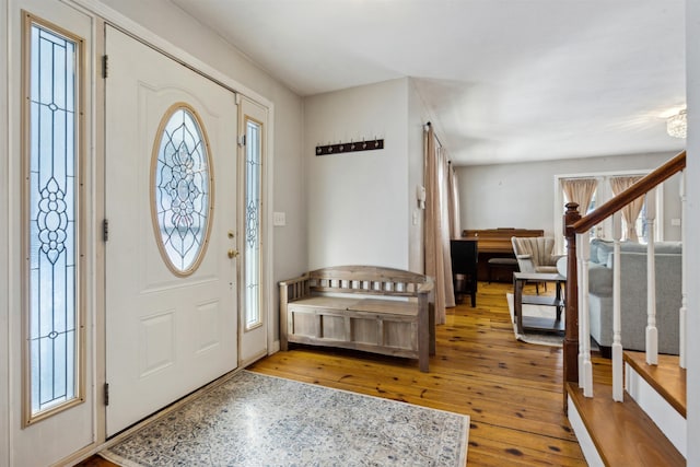 entrance foyer featuring hardwood / wood-style flooring and a healthy amount of sunlight