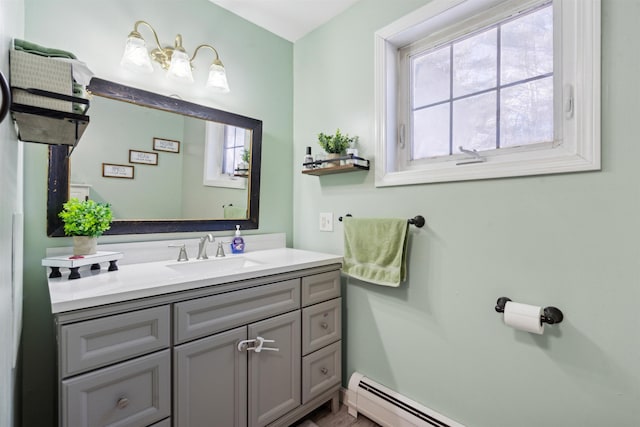 bathroom featuring vanity and baseboard heating