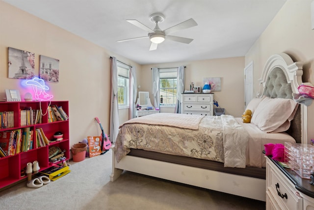 carpeted bedroom featuring ceiling fan