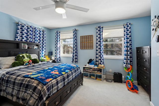 carpeted bedroom featuring ceiling fan