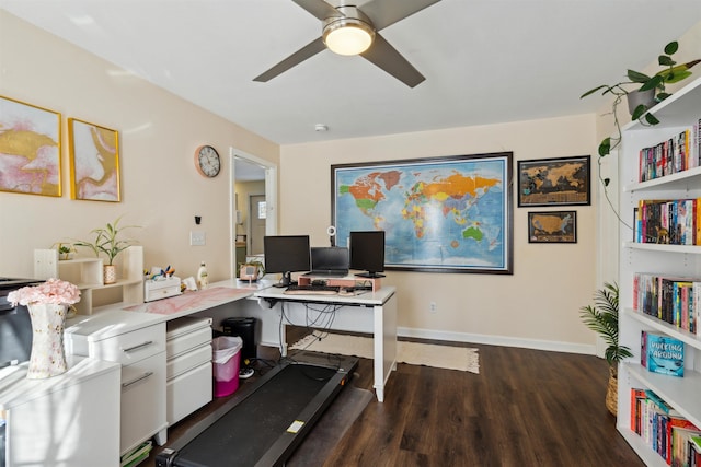 home office with dark wood-type flooring and ceiling fan