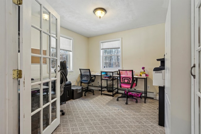 office area with light carpet and baseboard heating