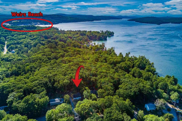 aerial view featuring a water and mountain view