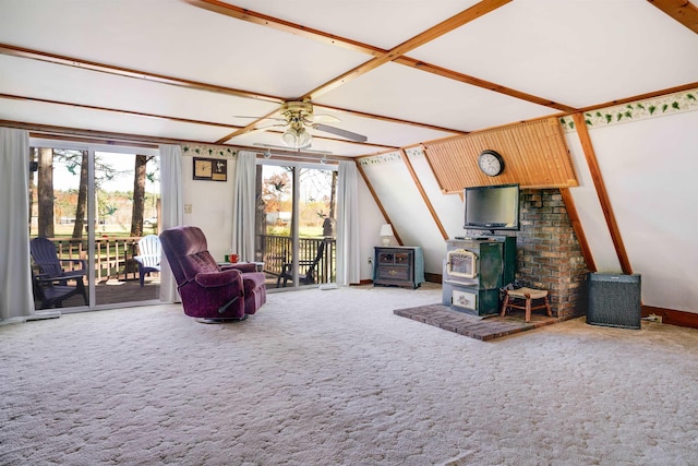 unfurnished living room with ceiling fan, carpet flooring, vaulted ceiling, and a wood stove