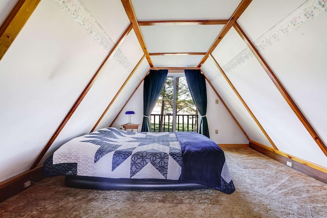 bedroom with vaulted ceiling and carpet