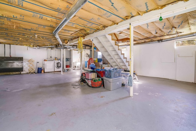 basement with washing machine and clothes dryer