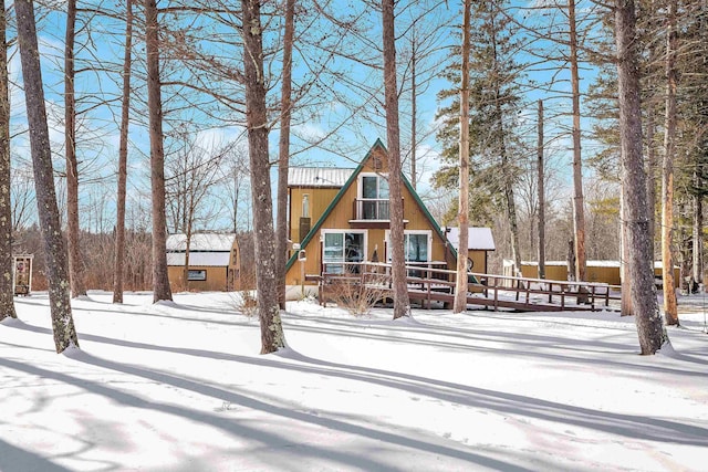 view of front of home with a wooden deck