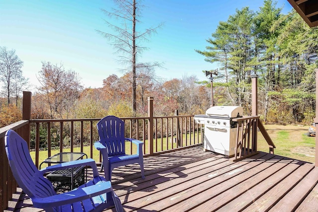 wooden deck with a grill