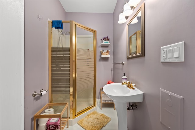 bathroom featuring tile patterned flooring and a shower with door