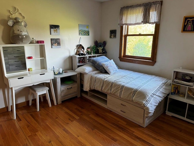 bedroom featuring dark wood-type flooring