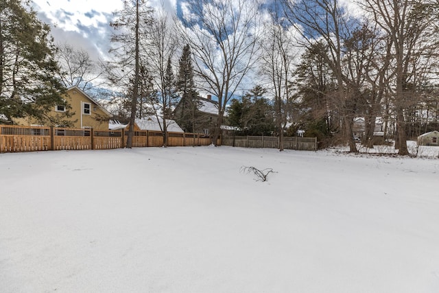 view of yard layered in snow