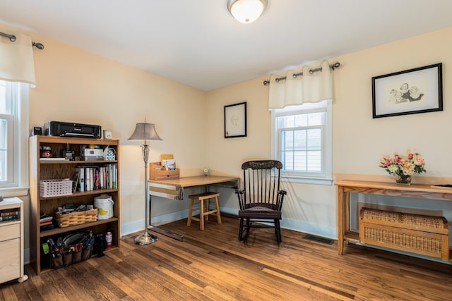 sitting room featuring dark hardwood / wood-style flooring