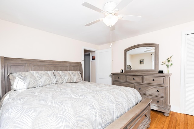 bedroom with light hardwood / wood-style flooring and ceiling fan