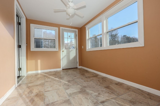 doorway to outside with ceiling fan