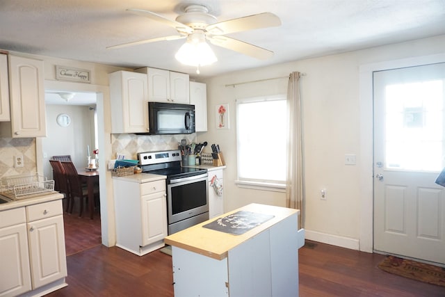 kitchen with white cabinets, a center island, stainless steel range with electric cooktop, and backsplash