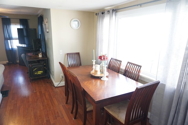 dining area featuring dark hardwood / wood-style flooring