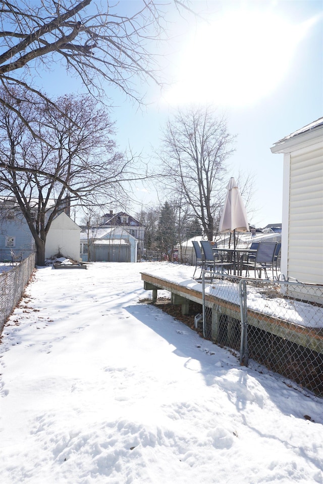 view of yard layered in snow