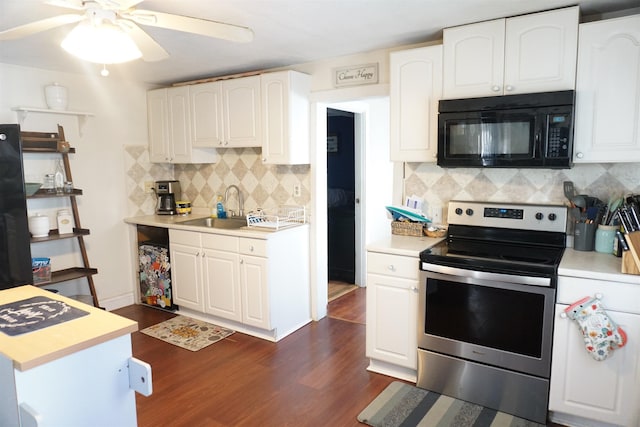 kitchen featuring electric stove, sink, dark wood-type flooring, white cabinets, and decorative backsplash