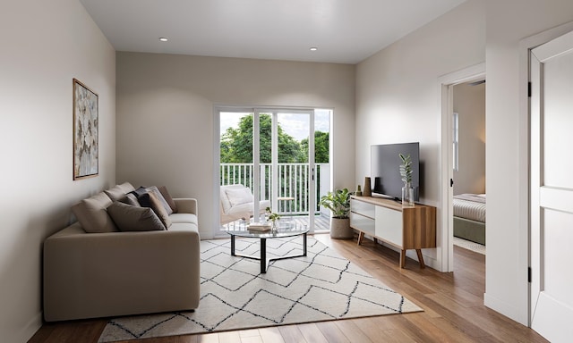 living area featuring recessed lighting, baseboards, and wood finished floors