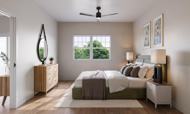 bedroom with baseboards, a ceiling fan, and light wood finished floors