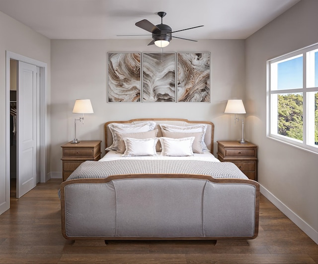 bedroom with baseboards, wood finished floors, and a ceiling fan