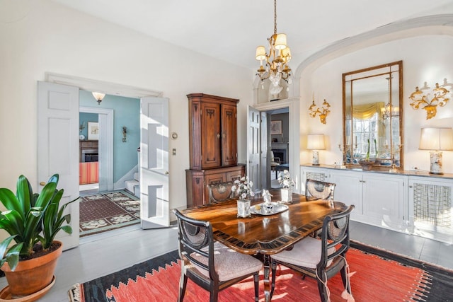 dining space featuring an inviting chandelier and hardwood / wood-style flooring