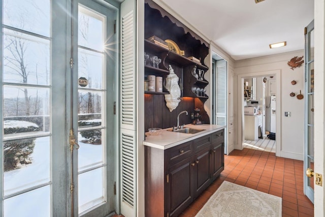 interior space with sink and tile patterned floors