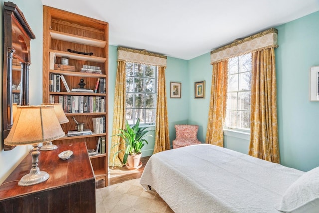 bedroom featuring multiple windows