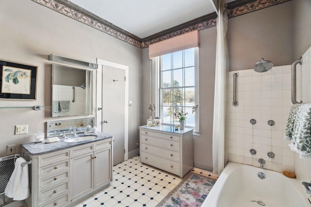 bathroom with vanity and tiled shower / bath